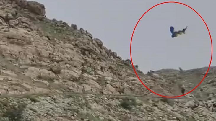 Paraşütçünün zor anları! Ters rüzgara kapılıp düştü